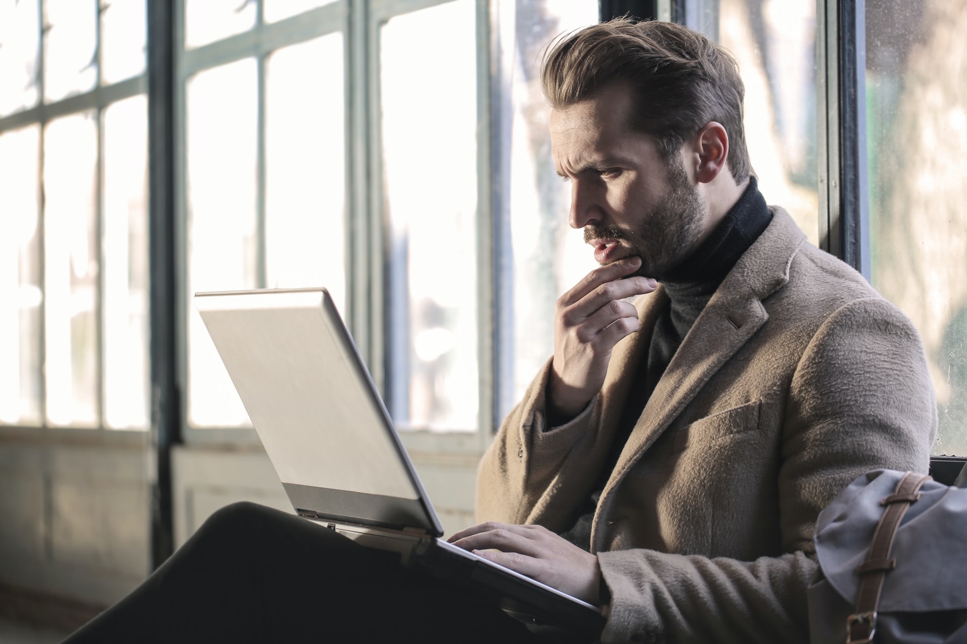 confused businessman with laptop