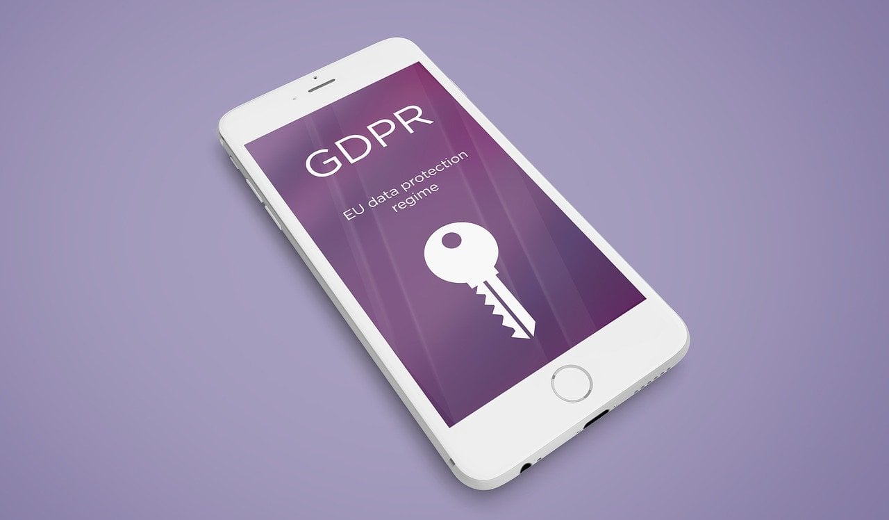 phone screen text: "GDPR EU data protection regime"